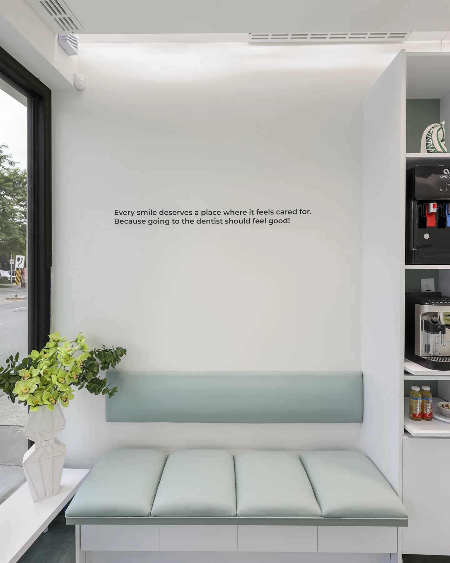 The waiting bench at Allo Dental Clinic, beneath the words: every smile deserves a place where it feels cared for