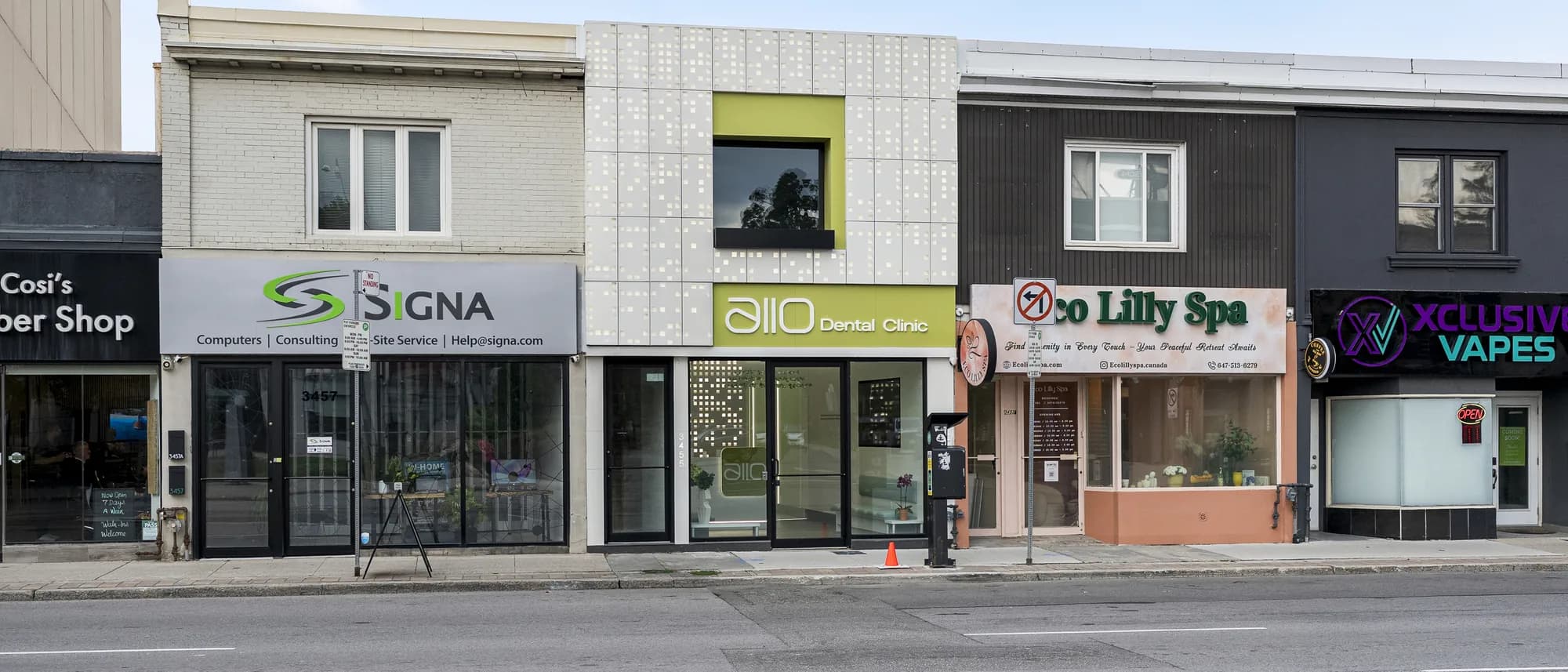 The Allo Dental Clinic storefront on the west side of Yonge Street, with the olive allo sign over a glass front, between the neighbouring shops