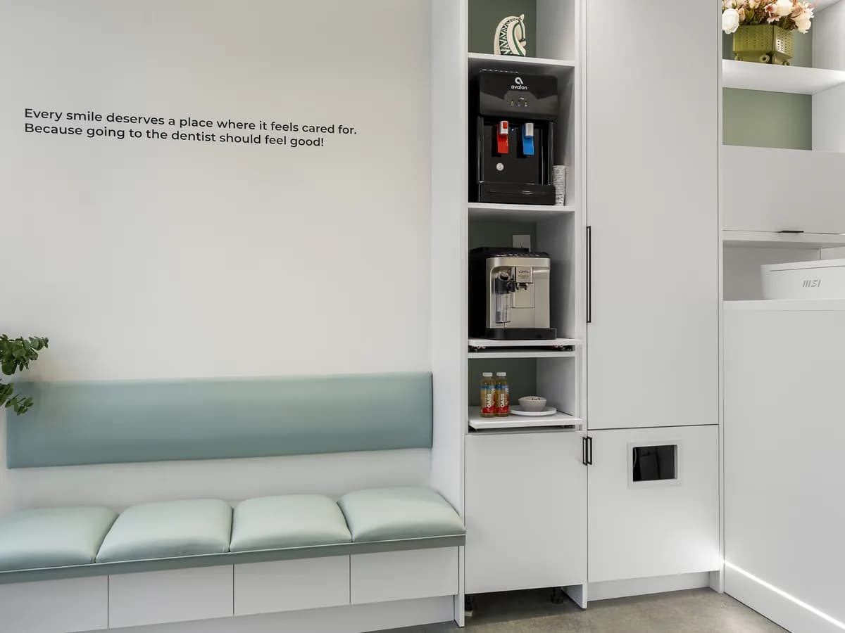 The mint waiting bench beside the tea and water station