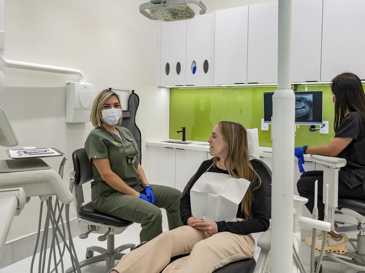 Dr. Rahmatian sitting and talking with a patient before the exam
