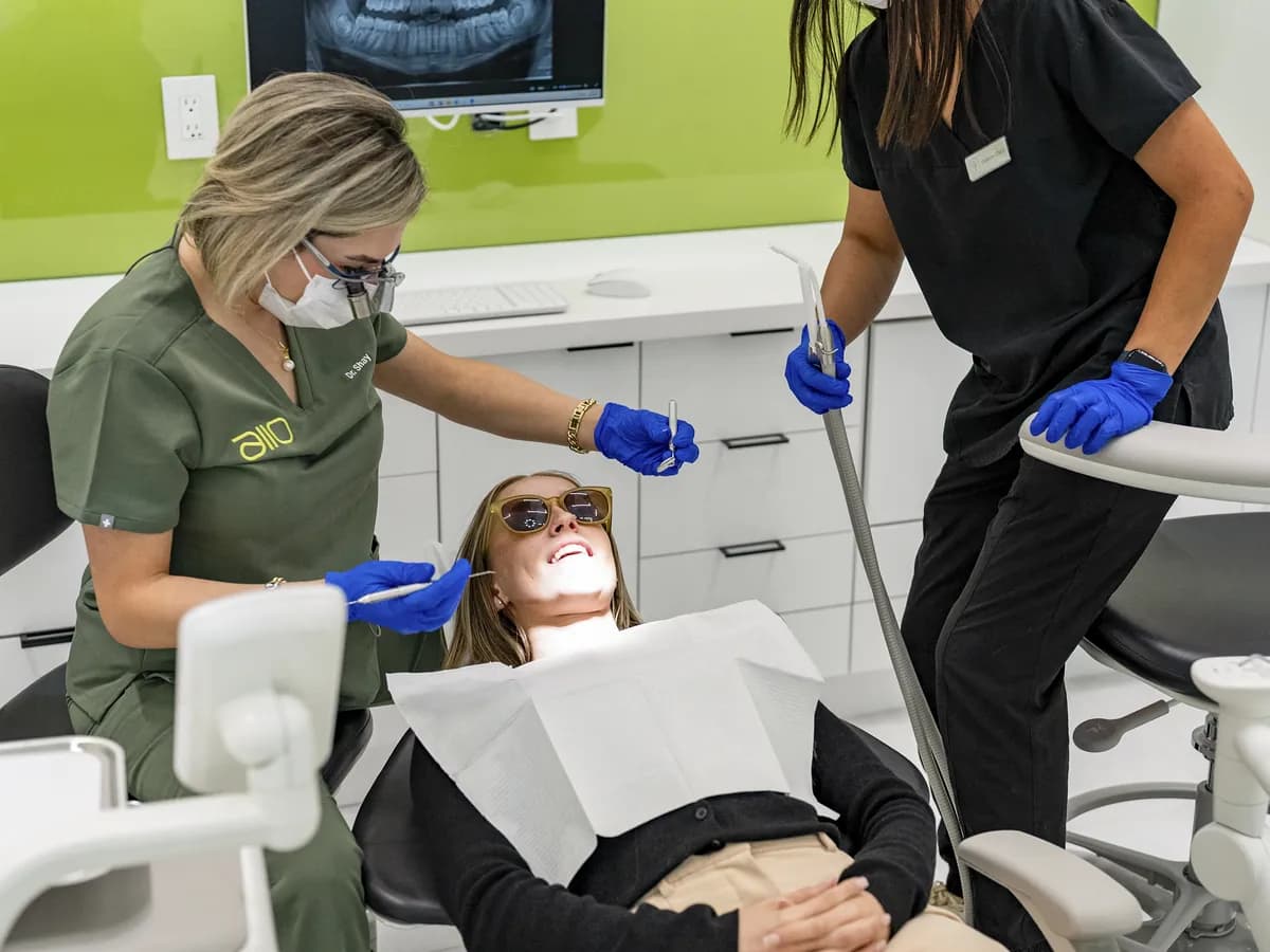 A hygiene clean in progress, the patient reclined with the team either side